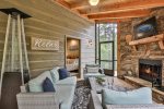 Outdoor wood burning fireplace with 50`` Flat screen TV  Heat lamp is not included for guest use